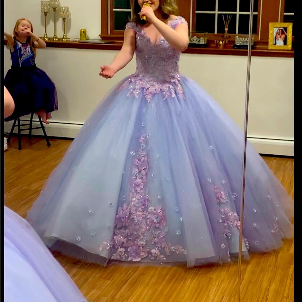 Beautiful lilac stoned quinceanera style dress is absolutely stunning.